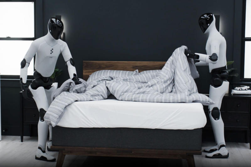 The figure‑robots gathered the room and set up a bed in the video.